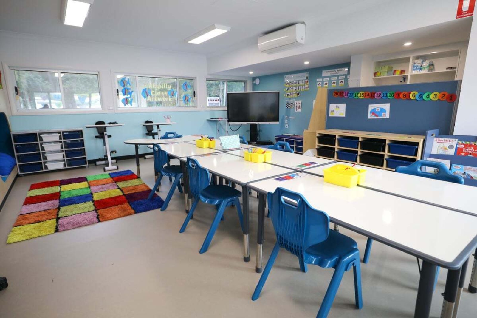 A multi-coloured, textured rug provides sensory stimulation for students.